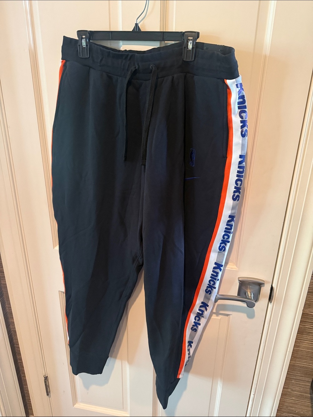 KnicksNike Black basketball Sweatpants with Orange and White Knicks Side Stripes